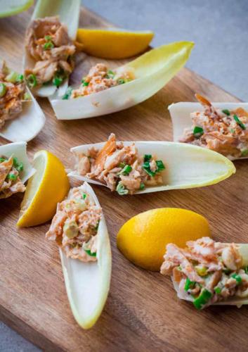 Hot smoked trout salad in endive spears